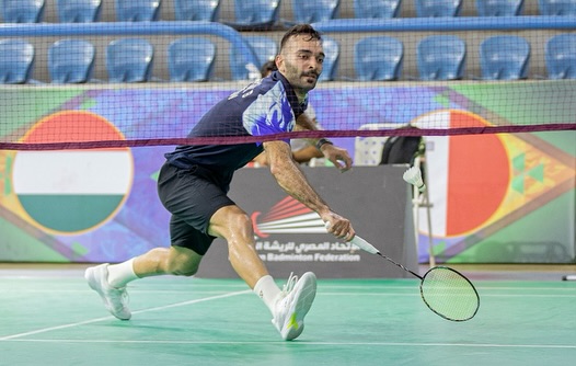 Moving low across the court to return a shot