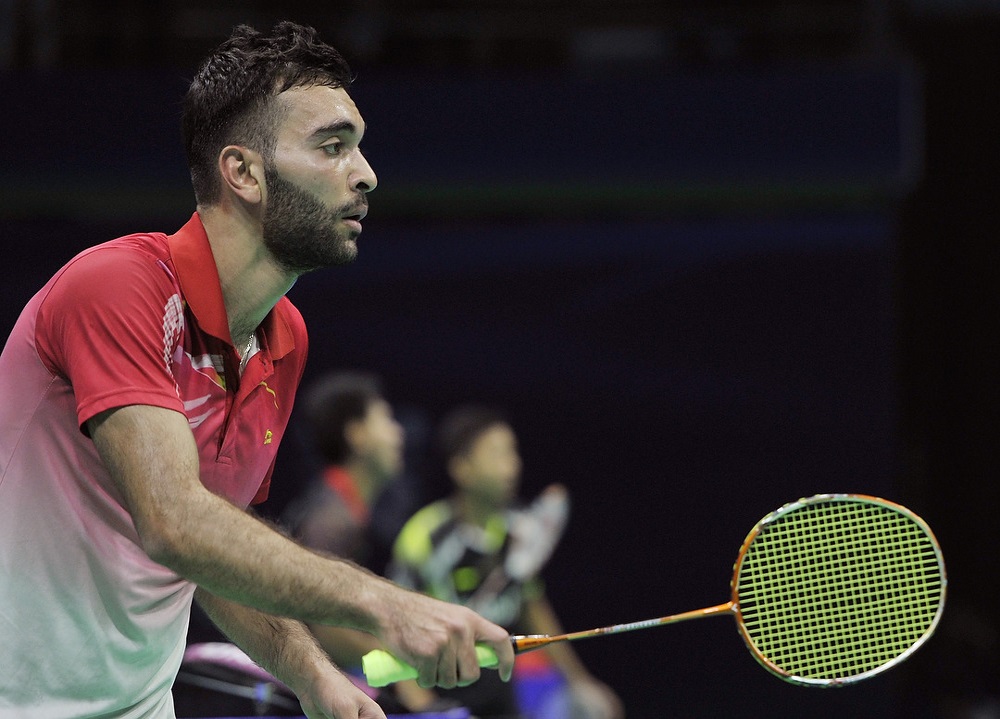 An earlier photograph on court in a red shirt